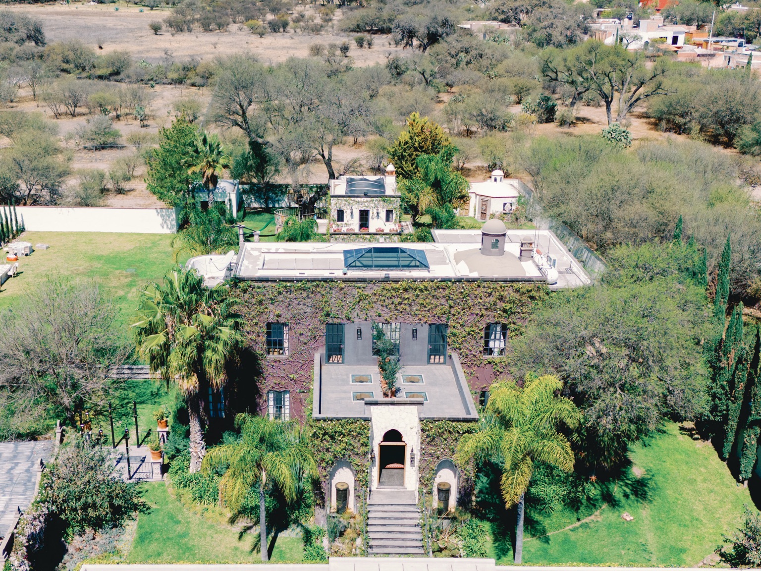 An aerial view of the main house and gardens at Hacienda Santa Ana